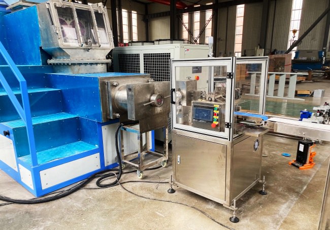 Automatic soap cutter machine cuts bars along complete soap production line